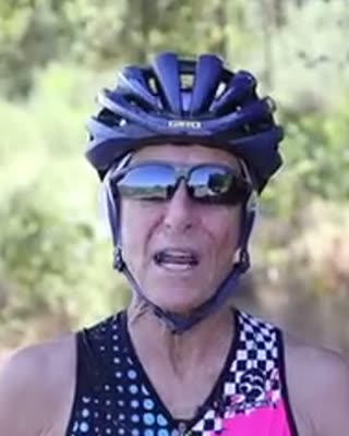 Pattie riding in a helmet and sunglasses